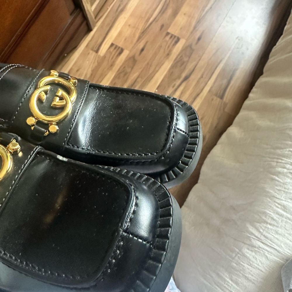 Gucci Black Loafers with Gold Emblem